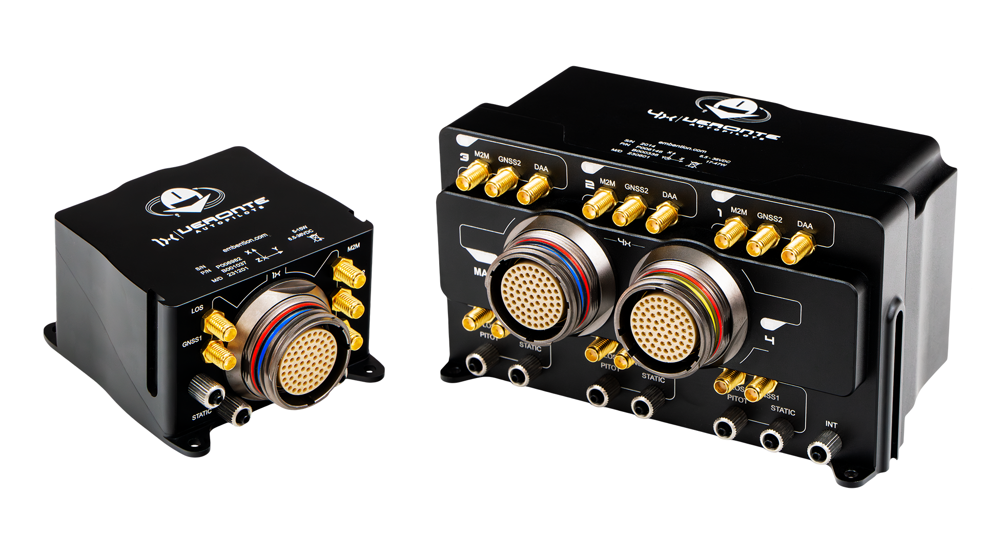 Array of black electronic modules with multiple gold-plated connectors, each featuring a central circular multi-pin port and various labeled ports like 'GNSS2', 'M2M', and 'PITOT', all mounted on a reflective surface.