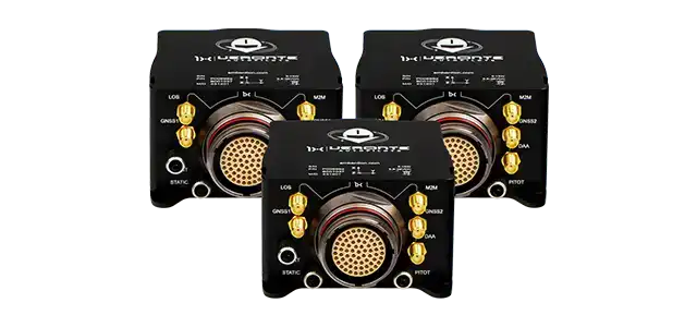 Three black electronic modules with gold-plated connectors and central circular interfaces, each marked with various labels including 'LOG', 'GNSS', and 'SYNC'.