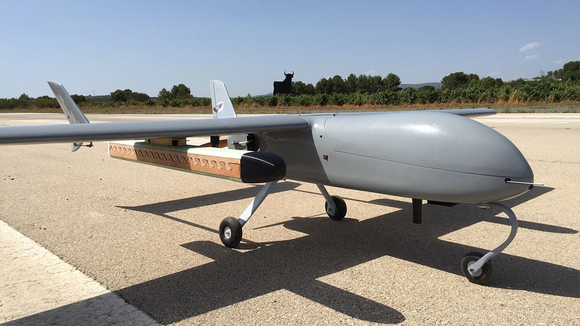 Drone equipped for sterile insect release on a runway.