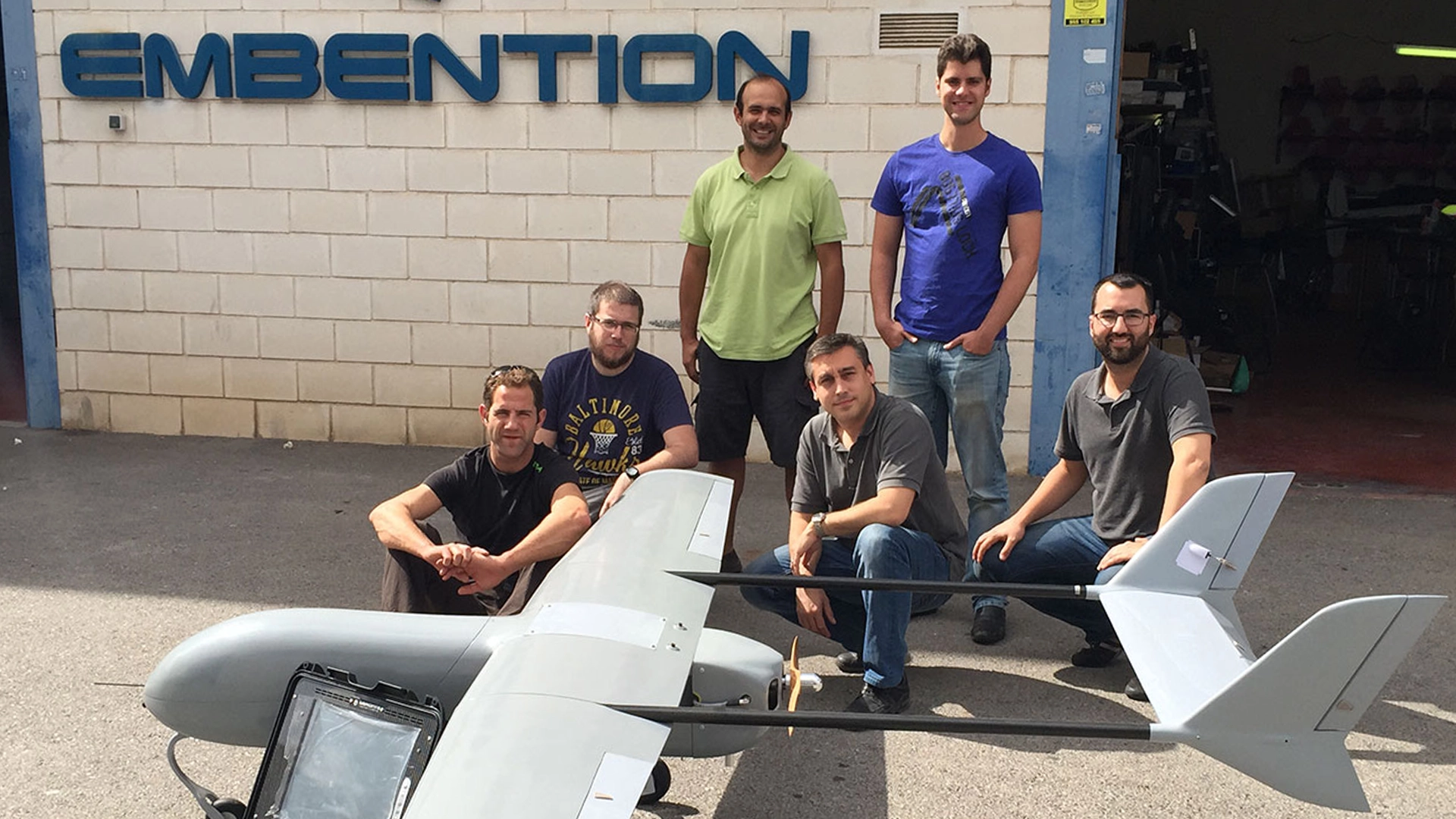 Team with drone at Embention facility.